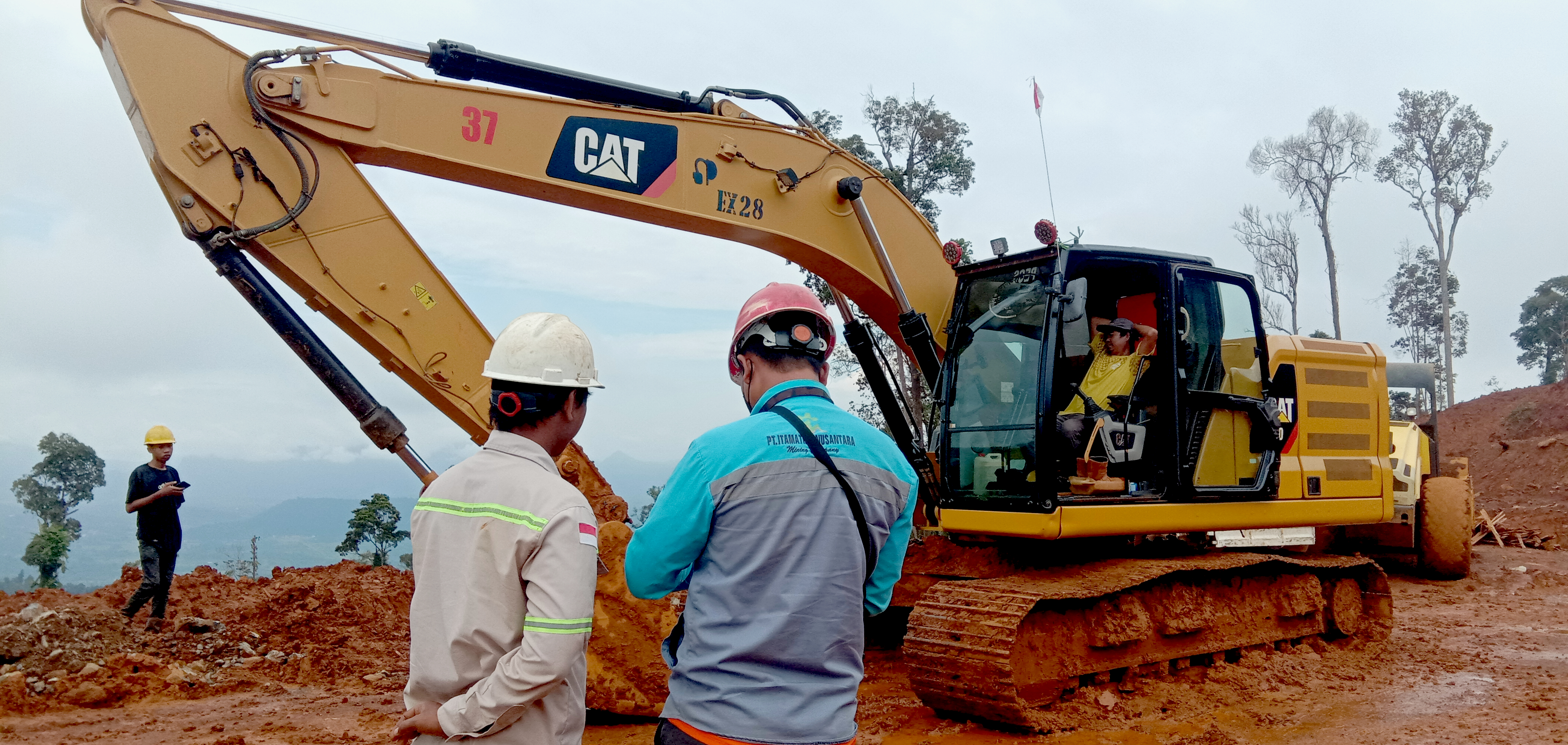 Mining drilling rig with workers